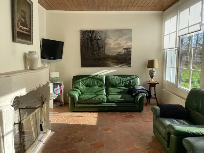 Bright, rustic living room with fireplace